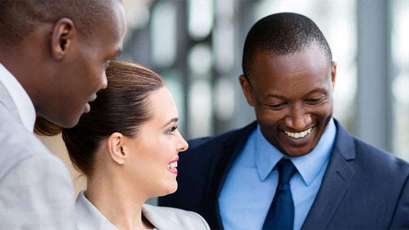 three people smiling